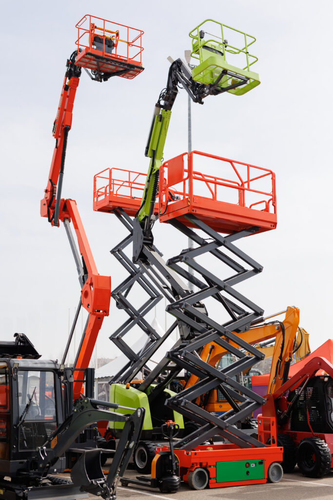 several different wheeled scissor lifts and wheeled articulated lists with telescopic boom.